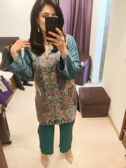 A mirror selfie showing the full outfit. I picked a contrasting pink from the paisley pattern for my stone earrings and heels, tying the whole look together.