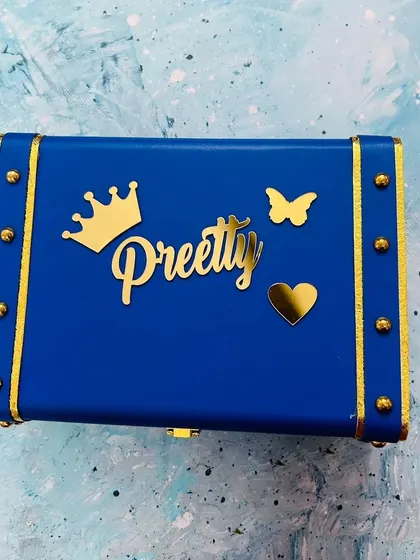 A royal blue trunk box customized for "Preetty," showing the versatility of color options available for these personalized keepsakes.