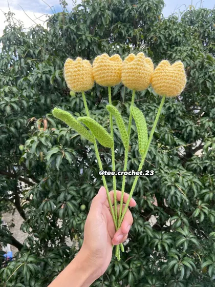 A handful of cheerful yellow tulip stems.