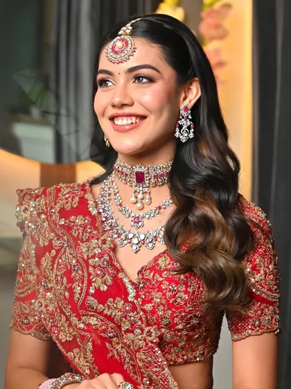 Her smile says it all. This look is a perfect balance of tradition and glam, making her feel confident and radiant.