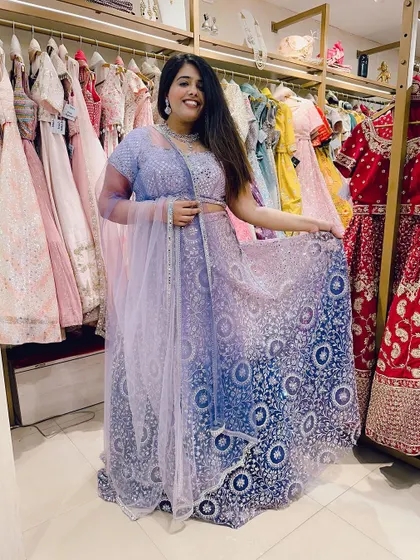 Trying on a beautiful ombre purple and blue lehenga. My store is a playground of colors and styles for you to explore.