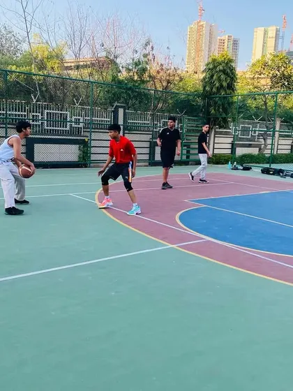 A player practices his one-on-one moves against a defender.