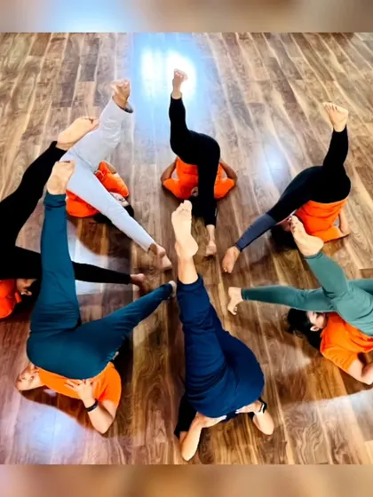 More fun with group yoga formations! These images capture the playful spirit and strong bonds forged in our training programs. It's all about connection and support.