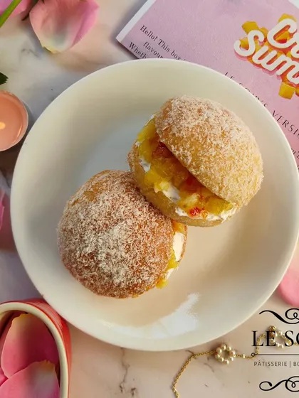 For the adventurous palate, my Chilli Piña Colada Doughnuts. These feature a doughnut sandwich with pineapple compote, coconut cream, and a hint of sweet chilli sauce.