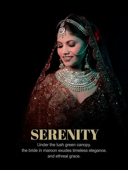 A serene portrait of a bride in a maroon lehenga, her eyes closed, capturing a moment of peace and anticipation.