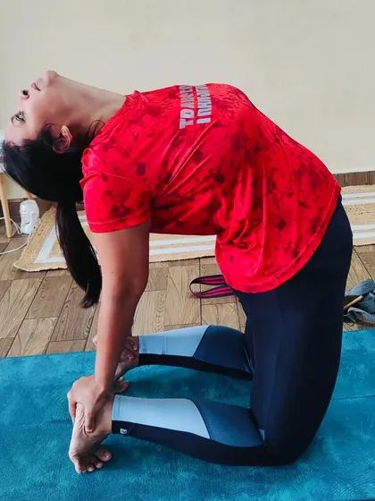 An amazing backbend by a student in Ustrasana (Camel Pose). This pose opens the entire front of the body, improves posture, and builds strength in the back.