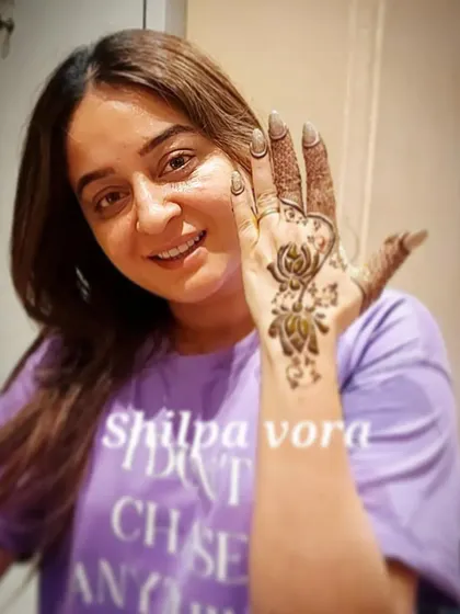 A happy client, actress Mahhi Vij, showing off her simple yet elegant lotus mehndi. I cater to all requests, from full bridal to minimalist designs.