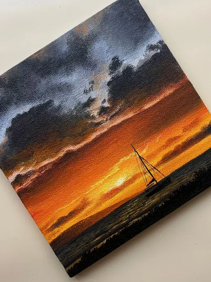Another shot of the sailboat sunset painting, capturing the moodiness of the scene.