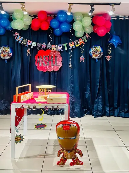 An action-packed Avengers and Marvel themed birthday decor setup, perfect for a little superhero's celebration.