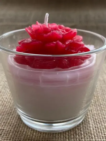 Another look at the beautiful rose-topped glass candle, a perfect and refreshing gift.