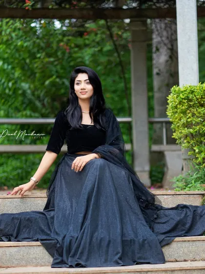 The elegance of this black lehenga is undeniable. We chose a location with beautiful architecture to create a regal and sophisticated portrait.