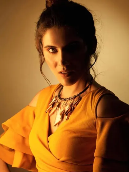 An experimental shot from a lighting workshop. I styled the model in a simple yellow top with a statement necklace, allowing the focus to be on how different colored gels and shadows can create a moody and artistic portrait.