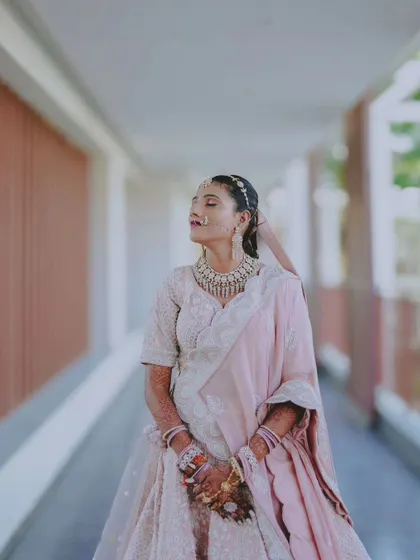 A candid and serene portrait of the bride with her eyes closed, taking in the moment.