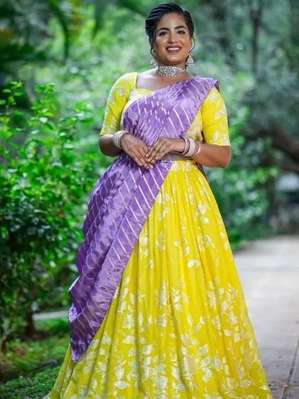 A full-length view of the yellow and purple half saree, perfect for dandiya.