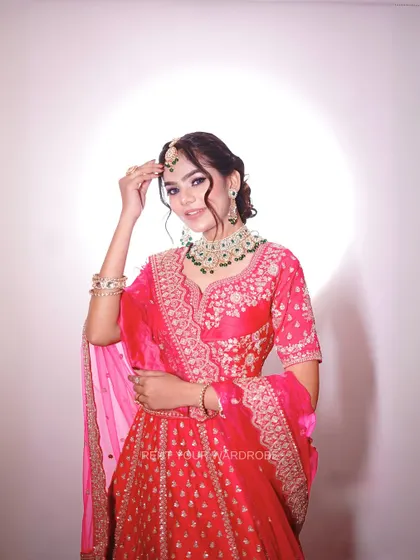 A close-up of the pink lehenga, highlighting the intricate embroidery on the blouse.