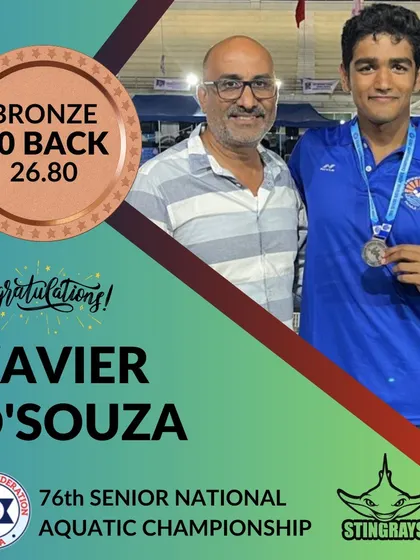 Xavier D'souza proudly displays his bronze medal for the 50m Backstroke at the Senior National Aquatic Championship. His performance showcases the specialized stroke training we emphasize.