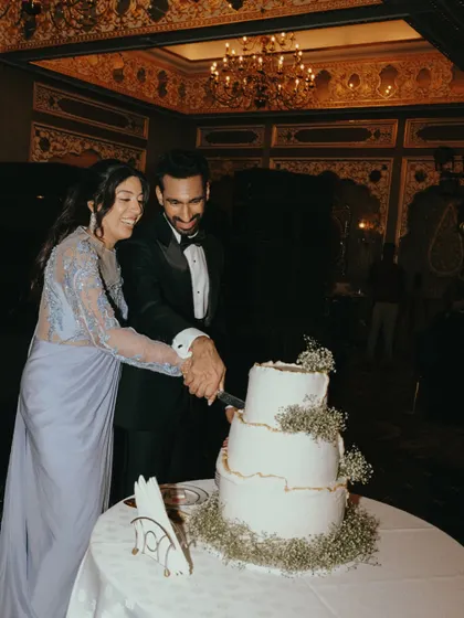 A happy moment of cake cutting for Sid and Kanika. These are the classic wedding moments, captured with genuine emotion.