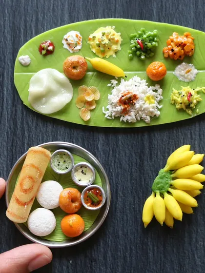 A collection of my most popular South Indian miniatures, including a full banana leaf meal, a breakfast platter, and a bunch of tiny bananas.