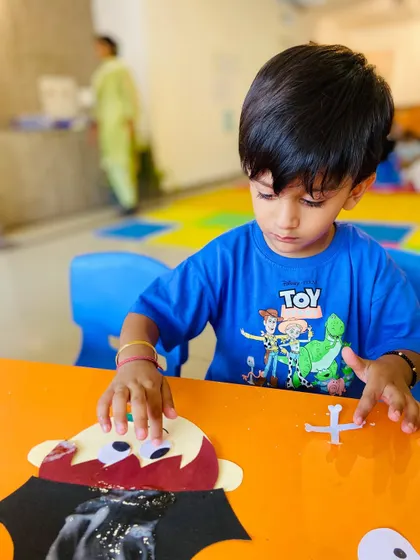 Getting into the Halloween spirit with a vampire craft. We love incorporating seasonal themes to make our art projects timely and exciting.
