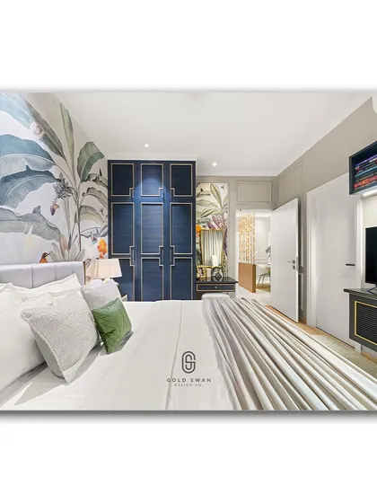 A wide shot of a bedroom featuring a stunning tropical wallpaper and a deep blue, panelled wardrobe. The combination of bold color, intricate patterns, and clean lines creates a space that is both luxurious and full of personality.