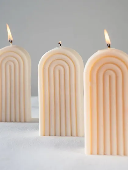 A trio of our arch or rainbow candles. Their minimalist, geometric shape makes them a perfect addition to any modern interior.