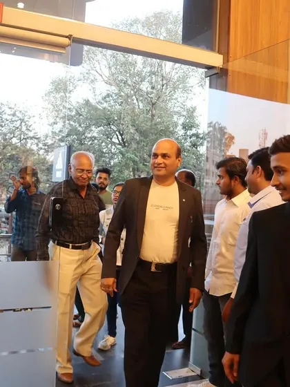 Arriving at the gallery for the inauguration ceremony, ready to celebrate the work of fellow artists.