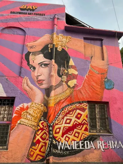 A colorful wall painting of legendary actress Waheeda Rehman, capturing the essence of classic Bollywood on a Bandra street.