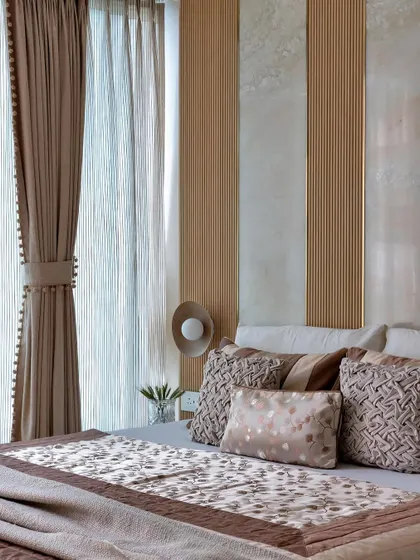 This earth-toned bedroom is a beige dreamscape designed to soothe the soul. By layering different shades of brown and beige with varied textures, I created a contemporary space that feels like a warm, cozy retreat.