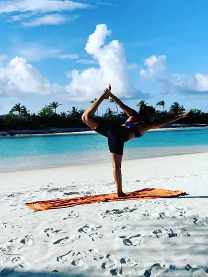 Finding balance and grace on a pristine white sand beach. This is Natarajasana, the Lord of the Dance pose, embodying the dynamic stillness we cultivate in our practice, surrounded by the beauty of the Maldives.
