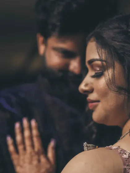 A soft and romantic close-up of the engaged couple, focusing on the bride's serene expression.