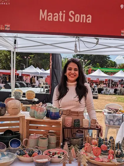 Here I am at a local market, surrounded by my creations. Meeting you in person and sharing the stories behind each piece is one of the most rewarding parts of my journey with Maati Sona.