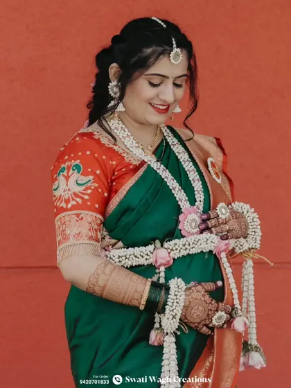 The beautiful details of the bride's embroidered blouse and our matching floral jewellery make for a stunning combination.