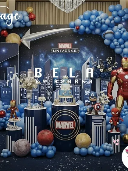 To show my range, I've included this epic Marvel Universe stage setup. It demonstrates how I can switch from soft and whimsical to bold and action-packed, using dynamic lighting, character props, and a cityscape backdrop to create a superhero's dream party.
