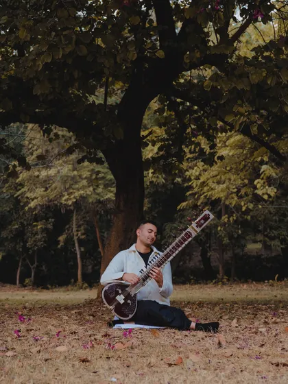 Finding a moment of peace to play under a tree.
