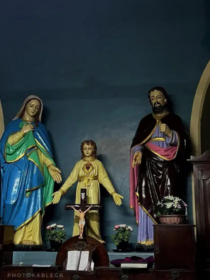 An indoor shot of religious statues within a church, showcasing the serene and devotional atmosphere of Christmas in Mumbai.