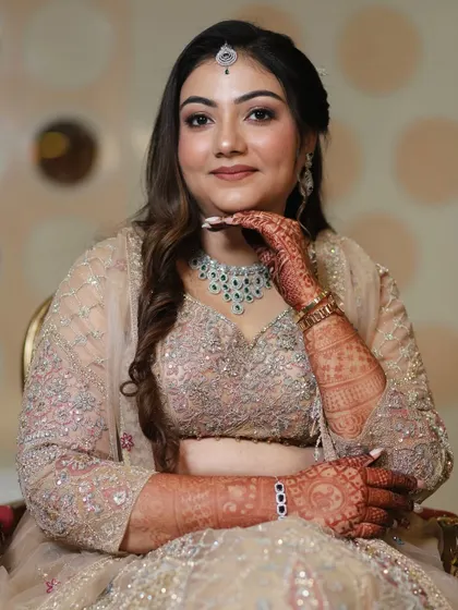 A portrait shot showcasing the complete engagement glam. The makeup, hair, and jewelry all work together to create a picture-perfect moment.