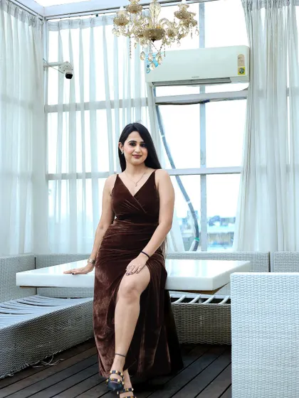 Using the bright, airy interior of the cafe, this shot has a fresh and modern feel. It showcases the influencer's style in a lifestyle context, which is highly effective for audience engagement.