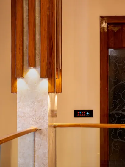 A smart panel on the upper level of a home, providing easy access to control lighting for the staircase and surrounding areas.
