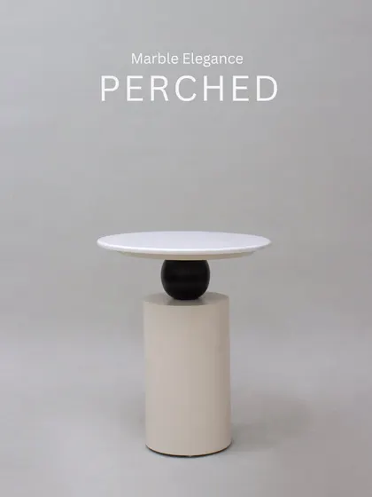 Marble elegance perched. This coffee table is a statement piece that plays with geometric forms and luxurious materials.
