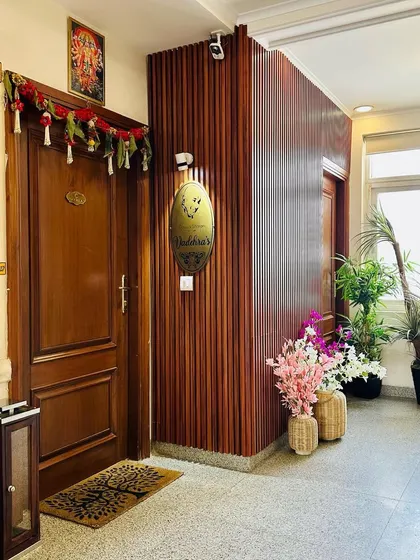 Another shot of the welcoming entryway, showing the arrangement of decorative elements like the lantern and doormat that complete the look.