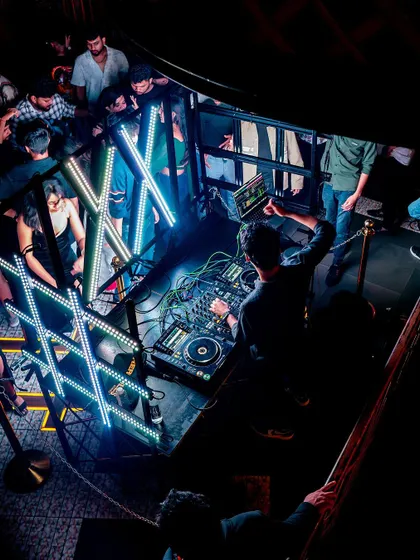 Another perspective on my DJ setup, showing the intricate wiring and gear I use to create my sound.