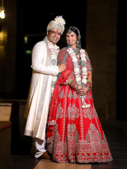 The quintessential wedding photo, capturing the couple in their full wedding attire. A beautiful memory of the day you said "I do."