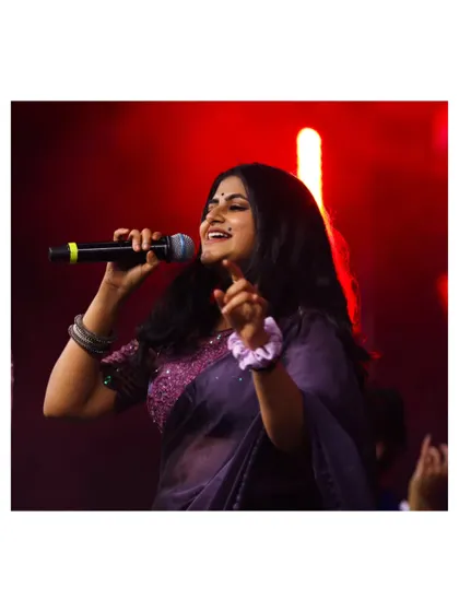 Singing a classic melody under the warm stage lights. We love mixing timeless hits into our setlists for all generations to enjoy.