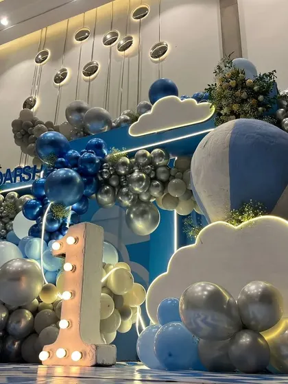 A detail shot of the light-up number "1" and the metallic balloon accents.