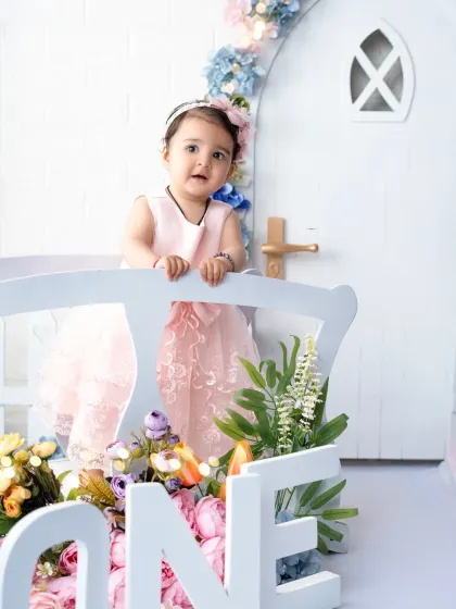 A curious glance from the birthday girl during her "One" photoshoot. I capture a variety of expressions, from big smiles to quiet, thoughtful moments.