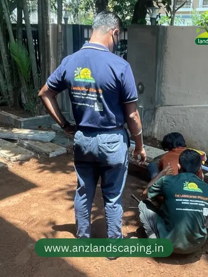 Our team laying the foundation and preparing the ground for a new lawn and pathway, the first step in a garden transformation.