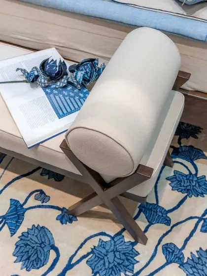 Can furniture be art? Our collaboration with Gaurang Home offers a resounding yes. This ottoman, upholstered in handwoven Khadi and set against a floral indigo rug, is a testament to that belief.