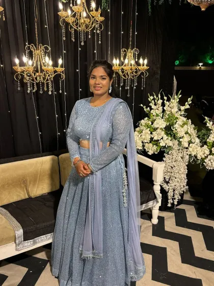 A close-up of the powder blue sequin lehenga. The full-sleeve blouse and delicate dupatta complete this sparkling sangeet night look.