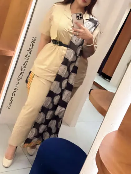 A different angle showing how the dupatta is draped and held in place by the belt, creating a defined waist and a professional silhouette.