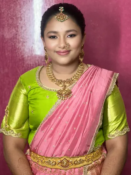 This bride's look is fresh and vibrant. I teach how to select the right shades to complement both the client's skin tone and their colorful attire, like this beautiful pink and green combination.